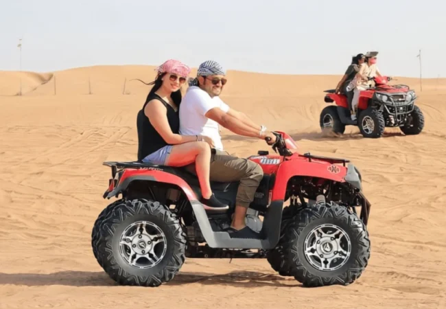 Yamaha 400cc double ATV carrying two riders in the Dubai desert